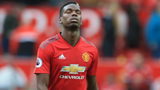 Manchester United's French midfielder Paul Pogba reacts as he leaves the pitch after the English Premier League football match between Manchester United and Wolverhampton Wanderers at Old Trafford in Manchester, north west England, on September 22, 2018. - The game finished 1-1. (Photo by Lindsey PARNABY / AFP) / RESTRICTED TO EDITORIAL USE. No use with unauthorized audio, video, data, fixture lists, club/league logos or 'live' services. Online in-match use limited to 120 images. An additional 40 images may be used in extra time. No video emulation. Social media in-match use limited to 120 images. An additional 40 images may be used in extra time. No use in betting publications, games or single club/league/player publications. /