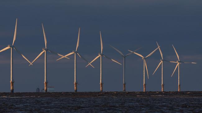 LIVERPOOL, ENGLAND - DECEMBER 07: Wind turbines generate electricity at Burno Bank Off Shore Wind Farm on December 07, 2022 in Liverpool, England. UK Prime minister Rishi Sunak has reversed his position on new onshore wind farms as the government said it will consult on proposals to allow further developments. (Photo by Nathan Stirk/Getty Images)