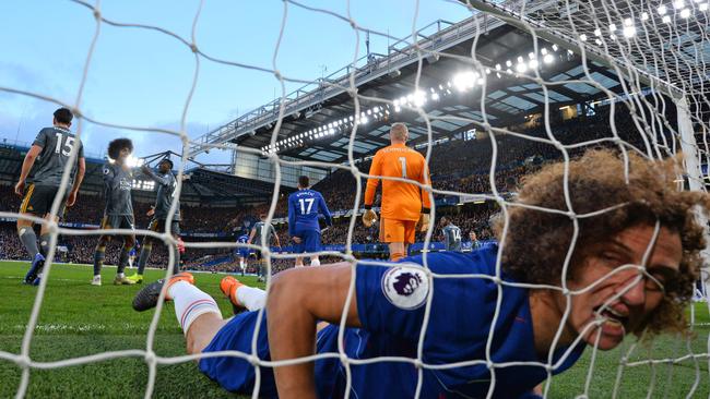 TOPSHOT - Chelsea's Brazilian defender David Luiz reacts as he finds himself in the Leicester goal after missing a good chance during the English Premier League football match between Chelsea and Leicester City at Stamford Bridge in London on December 22, 2018. (Photo by Ben STANSALL / AFP) / RESTRICTED TO EDITORIAL USE. No use with unauthorized audio, video, data, fixture lists, club/league logos or 'live' services. Online in-match use limited to 120 images. An additional 40 images may be used in extra time. No video emulation. Social media in-match use limited to 120 images. An additional 40 images may be used in extra time. No use in betting publications, games or single club/league/player publications. /