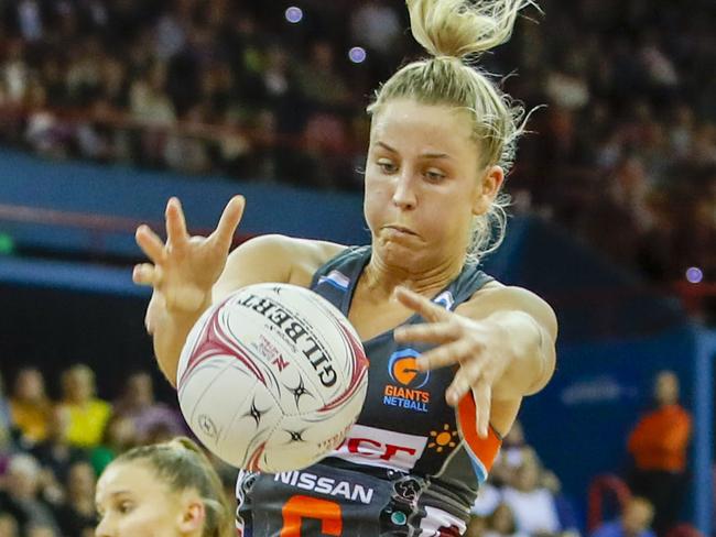 Jamie-Lee Price of the Giants chases down the ball during the Round 11 Super Netball match between the Queensland Firebirds and the Giants Netball at the Brisbane Entertainment Centre in Brisbane, Sunday, July 15, 2018. (AAP Image/Glenn Hunt) NO ARCHIVING, EDITORIAL USE ONLY