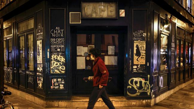 A man walks past the famous Paris bar Au Chat Noir, which is closed under measures to curb the spread of the COVID-19 in the French capital. Picture: AFP