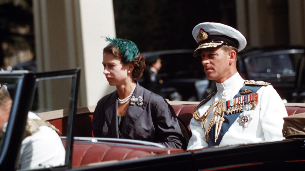 Queen Elizabeth II and Prince Philip pictured on the way to the Adelaide War Memorial where they laid a wreath during their Australian tour in 1954. Picture: Popperfoto/Getty Images