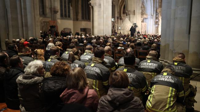 Firefighters attend a church service after a car-ramming attack on a Christmas market in Magdeburg, eastern Germany. Picture: AFP