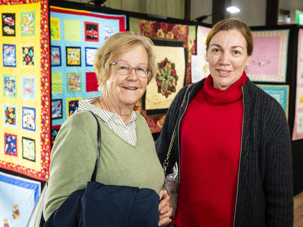 Anneke Schrale and daughter-in-law Rebecca Schrale admire the Toowoomba Quilters Club work on show at Craft Alive at the Goods Shed, Sunday, May 22, 2022. Picture: Kevin Farmer