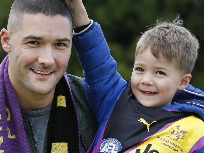 FOR MONDAY PAPER.  Richmond premiership player Shaun Grigg and his son Sonny launching Richmond FC's special guernsey for the Alannah and Madeline Foundation game against Collingwood in Round 19.  Picture: David Caird