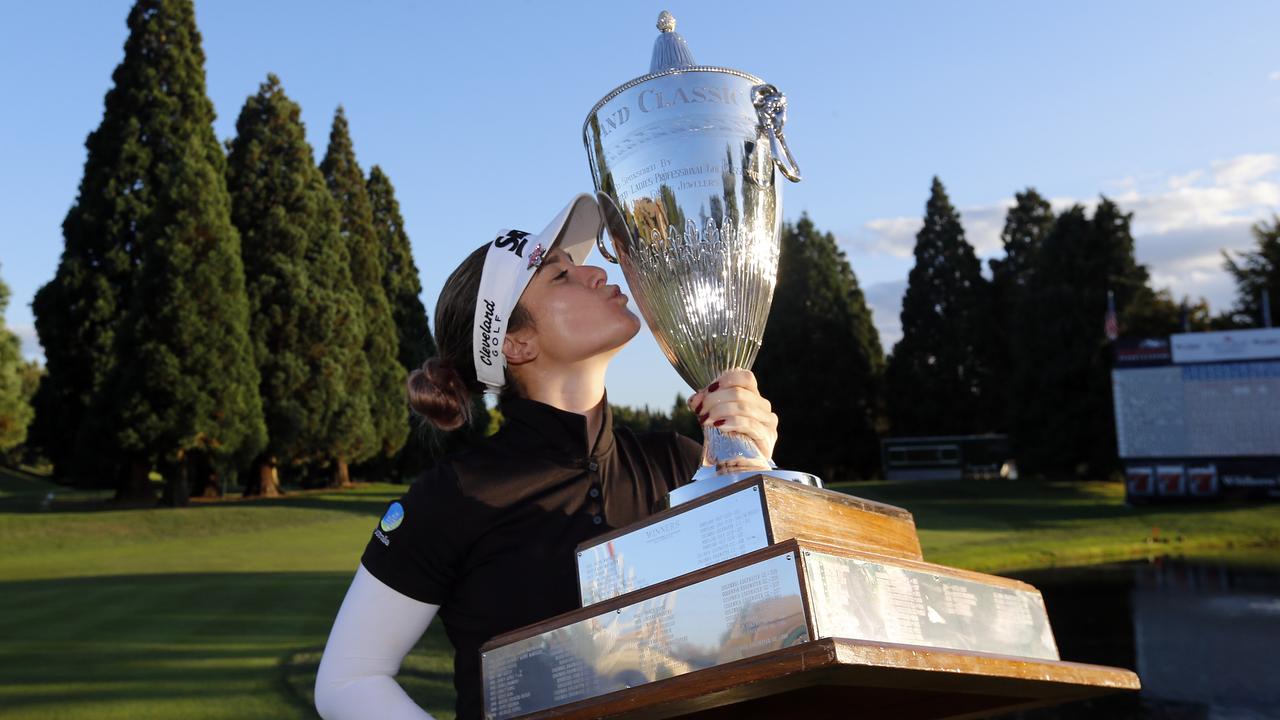 Hannah Green poses with the giant trophy.