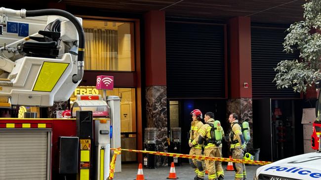 Firefighters outside the affected building on Bathurst St. Picture: Aymon Bertah