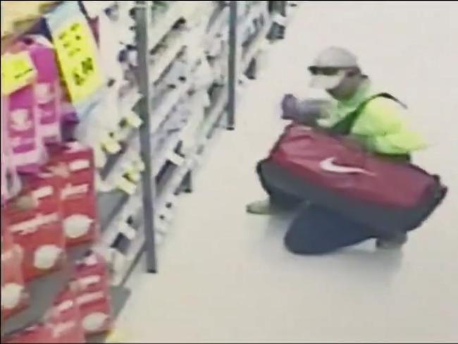 A man loads a bag with baby formula. Picture: Seven News