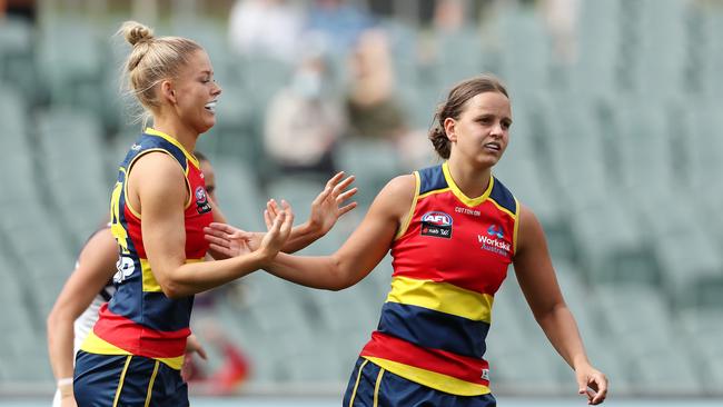 Danielle Ponter celebrates a goal with Ashleigh Woodland Picture: Sarah Reed/AFL Photos via Getty Images