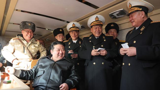 North Korean leader Kim Jong Un (front L) inspecting the evaluation test-fire of new-type surface-to-sea missile Padasuri-6 to be equipped by the navy, at an undisclosed location in North Korea. Picture: KCNA via KNS/AFP