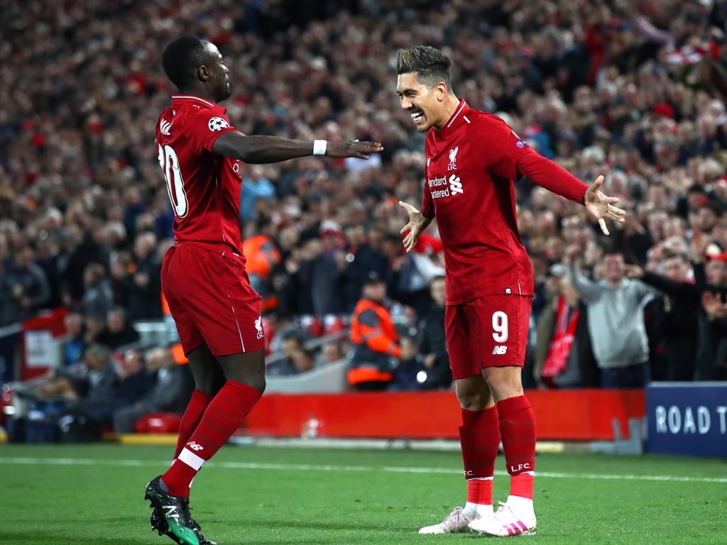 LIVERPOOL, ENGLAND - APRIL 09: Roberto Firmino of Liverpool celebrates after scoring his team's second goal with Sadio Mane of Liverpool during the UEFA Champions League Quarter Final first leg match between Liverpool and Porto at Anfield on April 09, 2019 in Liverpool, England. (Photo by Julian Finney/Getty Images)