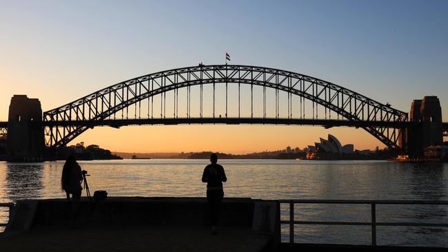 Sunrise over Sydney Harbour pictured from Blues Point. Picture: NCA NewsWire / Damian Shaw