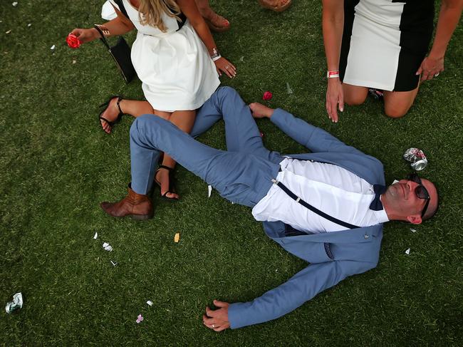 Melbourne Cup Day 2014 at Flemington Racecourse. Punters start to get a little raucous after the cup. Picture: Mark Stewart