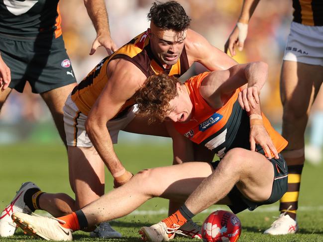 ADELAIDE, AUSTRALIA - APRIL 16: Conor Nash of the Hawks and Tom Green of the Giants during the 2023 AFL Round 05 match between the GWS Giants and the Hawthorn Hawks at Norwood Oval on April 16, 2023 in Adelaide, Australia. (Photo by Sarah Reed/AFL Photos via Getty Images)