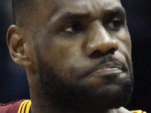 Cleveland Cavaliers forward LeBron James reacts after making a basket against the Milwaukee Bucks during the second half of an NBA basketball game Wednesday, April 8, 2015 in Milwaukee. The Cavaliers defeated the Bucks 104-99. (AP Photo/Darren Hauck)