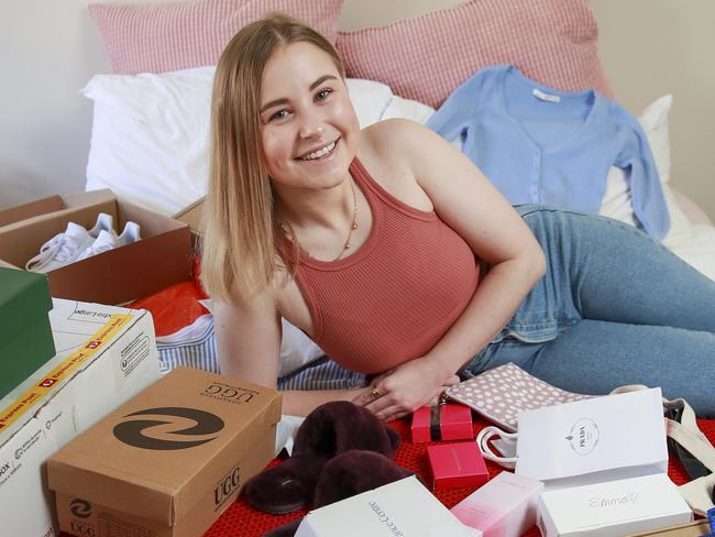 Rebecca Strickland, from Dulwich Hill, at home with some of the purchases she has bought using buy now pay later scheme Afterpay. Picture: Justin Lloyd