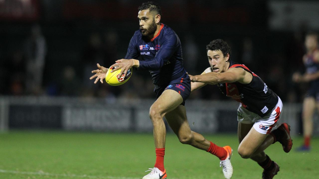 SANFL: Norwood v West Adelaide at Norwood Oval. Norwood's Dominic Barry escapes a lunging Thomas Keough for West. 31 May 2019. Picture Dean Martin