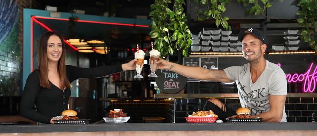 Mikaela Bielby and Christian Avant keep their distance at Milky Lane Bondi. Picture: Richard Dobson