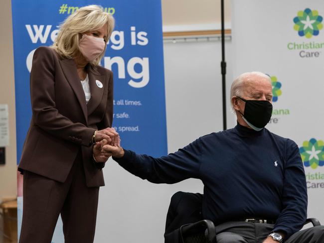 Scared of needles? Joe Biden is supported by wife Jill Biden at a vaccination centre. Picture: AFP