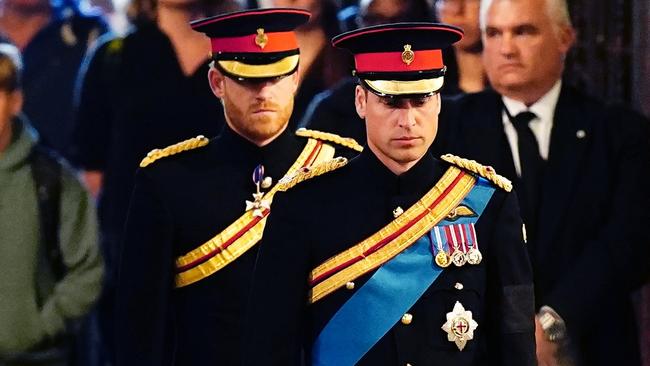 Prince William, Prince of Wales, Prince Harry, Duke of Sussex arrive to hold a vigil in honour of Queen Elizabeth II at Westminster Hall.