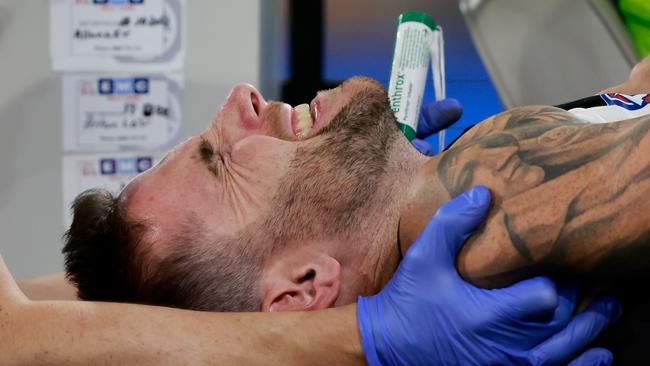 MELBOURNE, AUSTRALIA - MARCH 17: Jeremy Howe of the Magpies leaves the field on a stretcher during the 2023 AFL Round 01 match between the Geelong Cats and the Collingwood Magpies at the Melbourne Cricket Ground on March 17, 2023 in Melbourne, Australia. (Photo by Dylan Burns/AFL Photos via Getty Images)