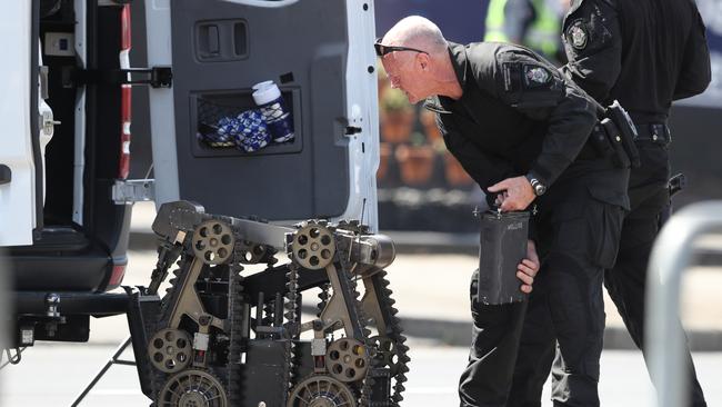 Police and Bomb Response Unit officers at Prestige Hand Car Wash in North Melbourne.