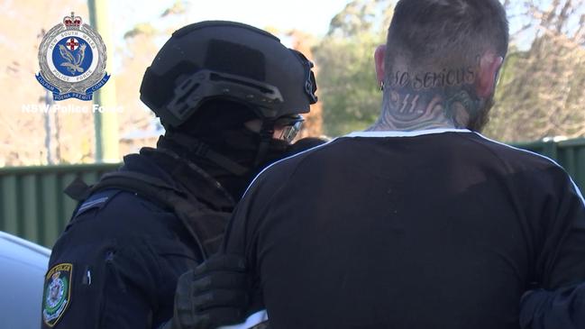 The man’s SS tattoo can be seen on his neck and the words ‘why so serious?’, a line by Heath Ledger’s Joker from the film Dark Night. Picture: NSW Police