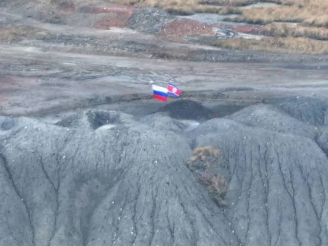 A photo circulated on Telegram which purports to show a North Korea flag flying alongside the Russian flag in Ukrainian territory. Picture: @milinfolive_man/TELEGRAM