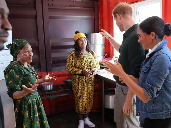 The royals chat to charity workers at the Lunchbox Fund, which provides nearly 30,000 nutritious meals every day to townships and rural areas. Picture: Chris Jackson/Pool/Getty Images