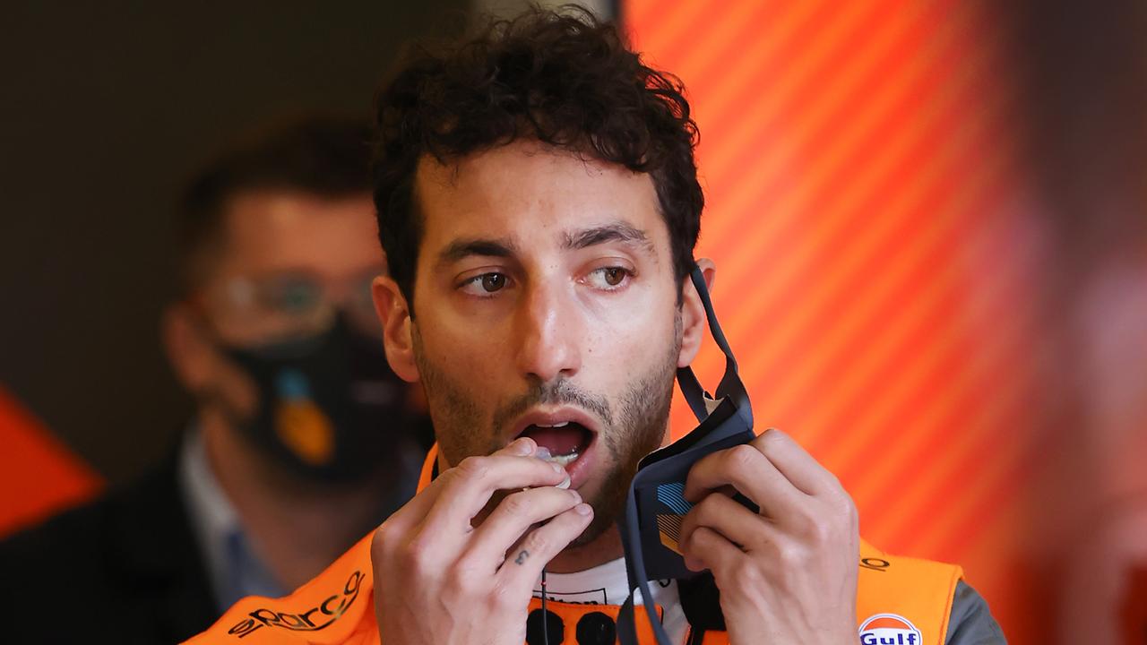 2022 Melbourne Grand Prix. F1 Practice 2. McLaren driver Daniel Ricciardo wets his ear plugs before putting on his helmet for P2. Picture: David Caird