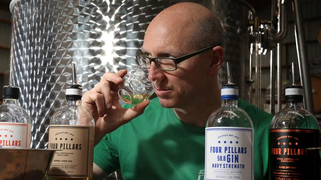 Local flavour feature is on Four Pillars Gin who have opened a distillery in Healesville. The co-owner Cameron Mackenzie smells his product. Picture : Stuart Milligan