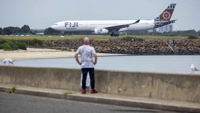 A Fiji Airways plane taxis along the runway of Sydney International Airport. Picture: NCA NewsWire / Jenny Evans