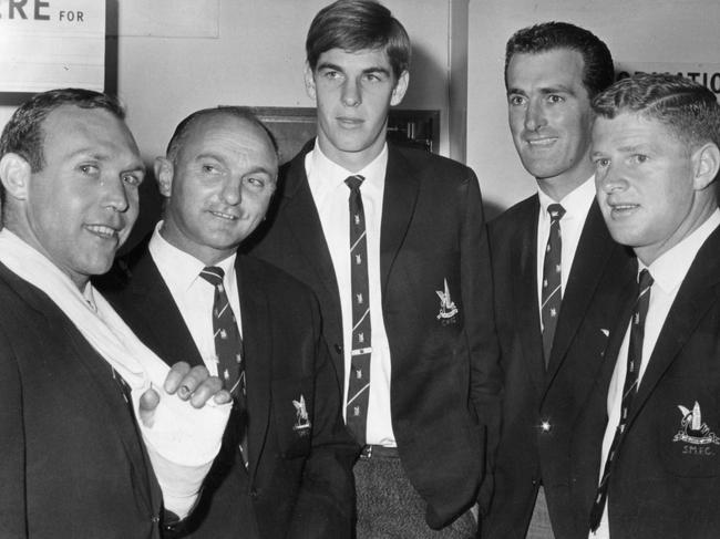 Max Papley (right) with teammates (L-R) Bob Skilton, coach Alan Miller, ruckman Stuart Bennett and full back John Herriott arrive at Adelaide Airport before playing in a match at Port Adelaide in 1967.