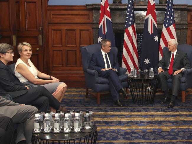 Labor’s Senate leader Penny Wong, and Deputy Leader Tanya Plibersek look on as Bill Shorten and Mike Pence converse, Picture: AP Photo/Rick Rycroft