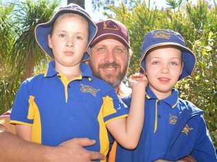 Twins Hannah and Eliza take to the green with their dad Adam. Picture: Ebony Graveur