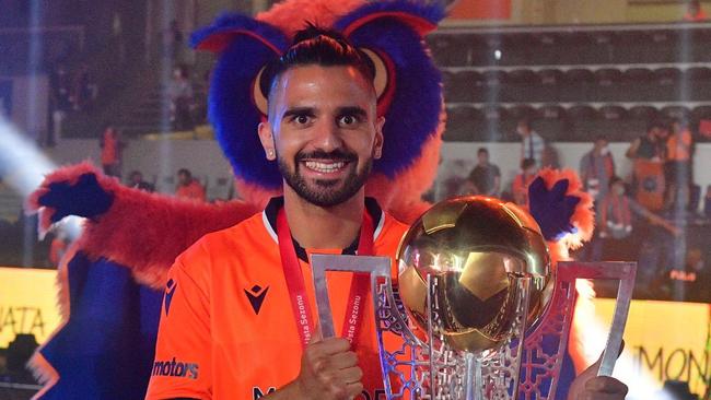 Aziz Behich shows off the spoils of victory.