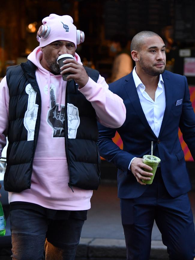 John Hopoate (right) supports his son during a court date last year at Central Local Court.