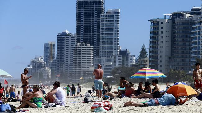 People njoying the sun and water at Surfers Paradise Beach on a hot Boxing Day. Picture: Jerad Williams