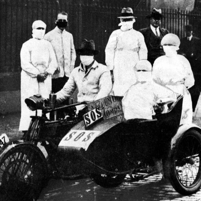 Medical staff and an emergency motorcycle crew outside a Sydney emergency centre during the 1919 Spanish flu pandemic.