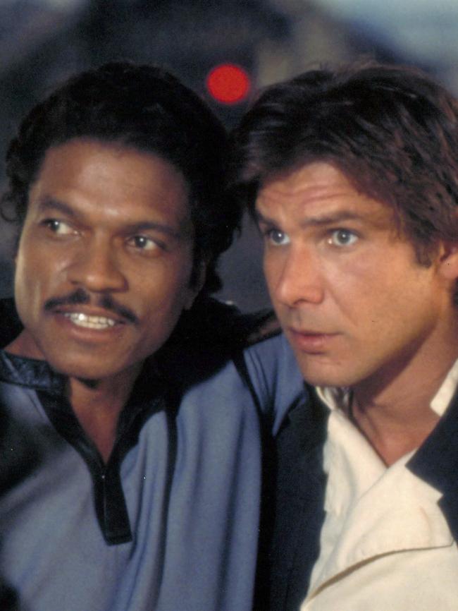 Billy Dee Williams as Lando Calrissian and Harrison Ford as Han Solo.