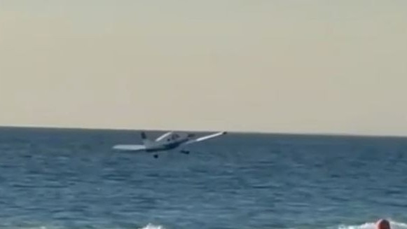 Onlookers were shocked to see the plane soaring into the beach. Picture: Nine News