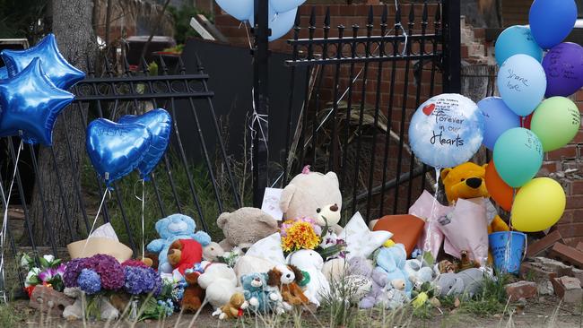 Tributes, flowers and teddy bears at the crash scene. Picture: Jonathan Ng