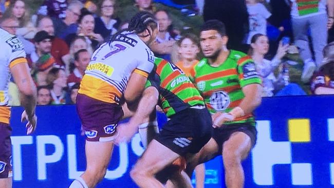 Broncos prop Marty Taupau lifts his leg in the tackle of South Sydney’s Campbell Graham on the Sunshine Coast last night. Photo: Fox League