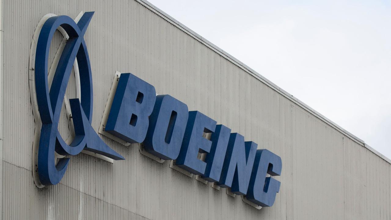 In this file photo taken on March 12, 2019 the Boeing logo is pictured at the Boeing Renton Factory in Renton, Washington. - Newly-disclosed documents "appear to point to a very disturbing picture" about Boeing's response to safety issues regarding the 737 MAX, a US congressional aide told AFP on December 24, 2019. Boeing sent the documents "late in the evening" Monday just hours after ousting Dennis Muilenburg as chief executive, according to the aide with the US House Transportation Committee (Photo by Jason Redmond / AFP)