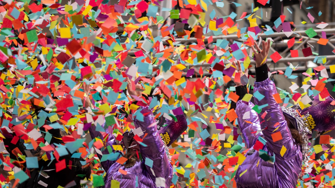 Confetti falls on a deserted Times Square as New York forges ahead