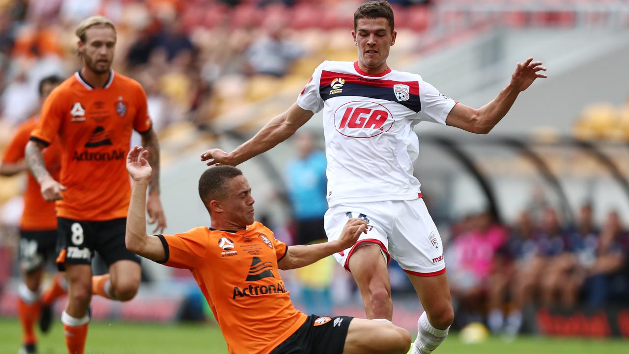 Adelaide United won an eight-goal thriller against Brisbane Roar.