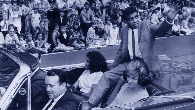 Lionel Rose waves to the crowd in a triumphant homecoming after winning the world bantamweight crown in 1968