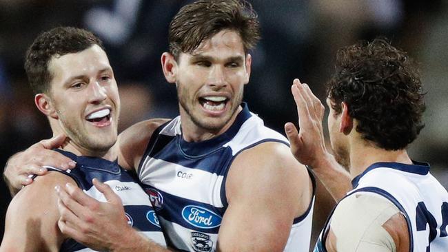 Geelong players celebrate a goal on Saturday night. Picture: Getty Images