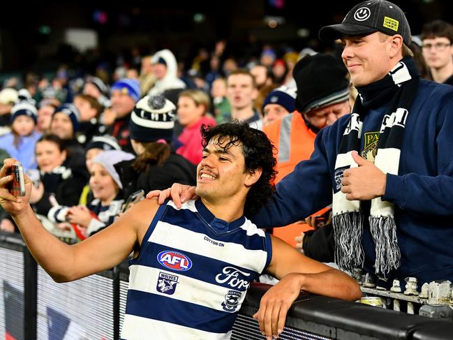 Lawson Humphrie poses with fans after the Cats win over the Bombers at the MCG. Picture: Getty Images