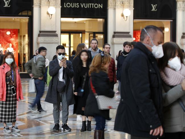 Tourists wearing masks in downtown Milan, Italy. Picture: AP